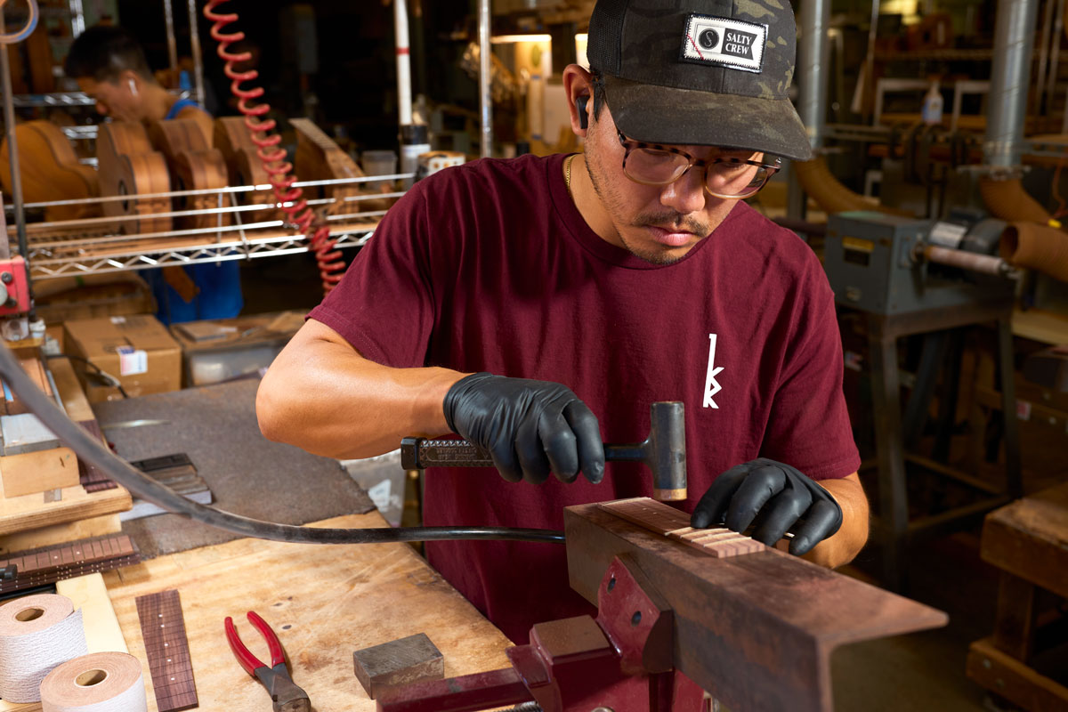 Craftsman working on ukulele repair